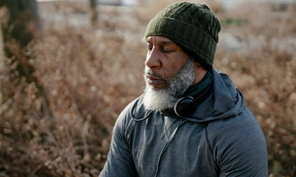 Man meditating in nature- Holistic Mental Health Care