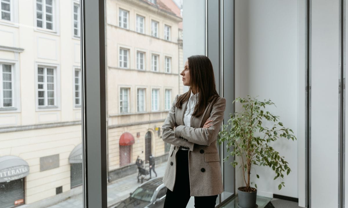 woman looking out a window